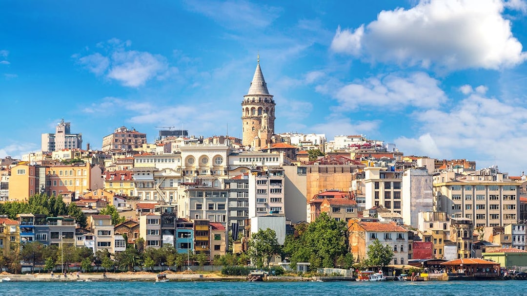 Galata Tower rising above Istanbul's historic skyline by the waterfront.