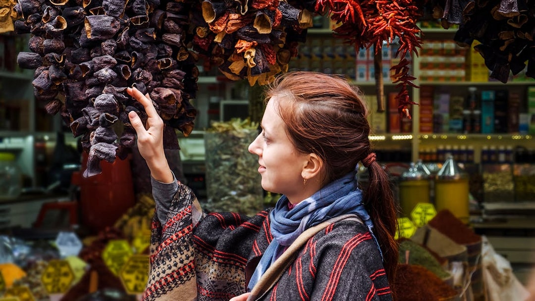 Woman exploring spice market on Istanbul Asian Side Walking Tour.