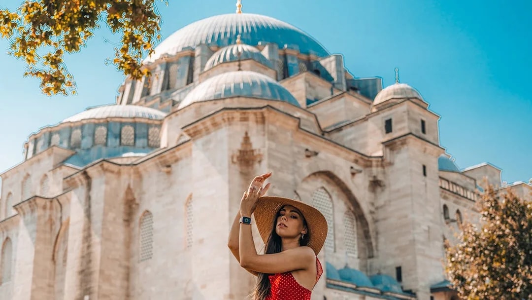Woman in front of a historic mosque in Istanbul during a half-day walking tour.