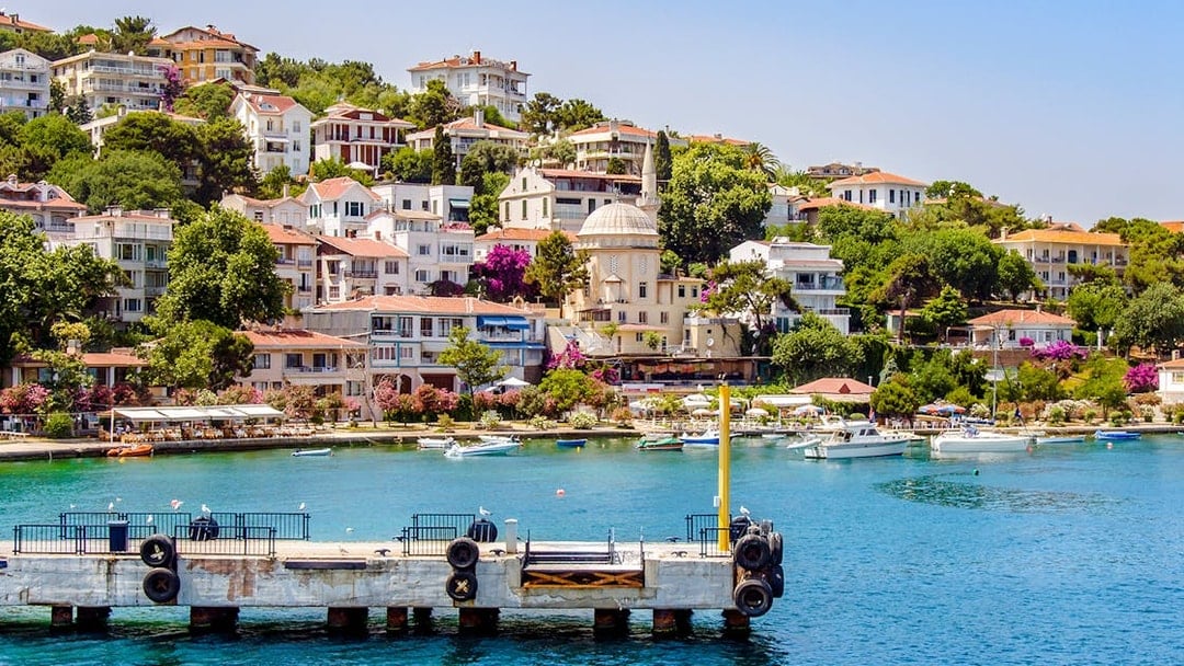 Burgaz Island waterfront with boats and hillside houses, Princes Islands, Istanbul.