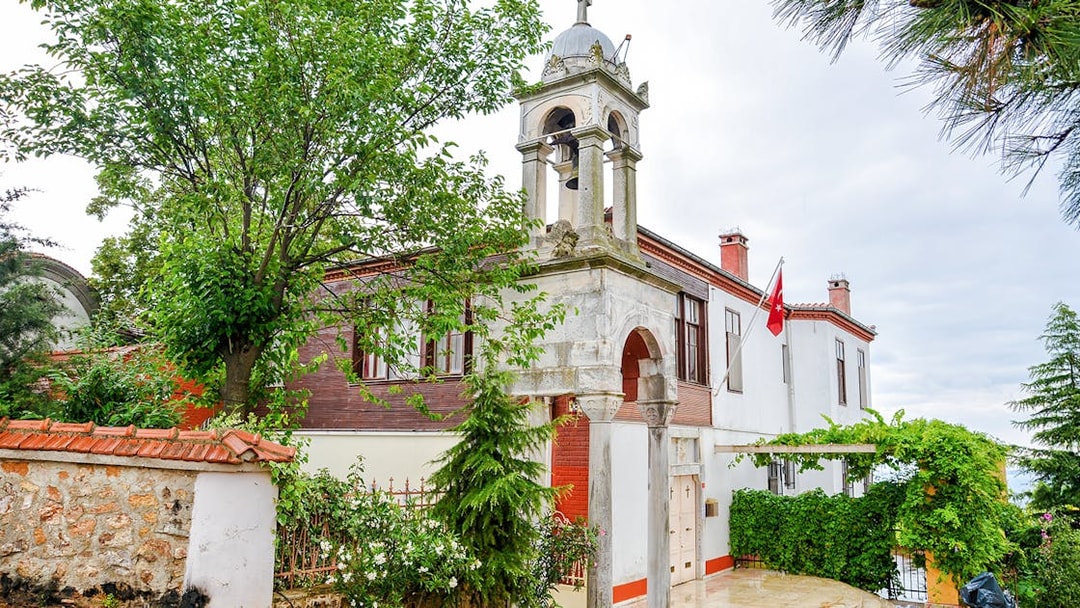Aya Yorgi Monastery exterior with bell tower and Turkish flag, Buyukada.