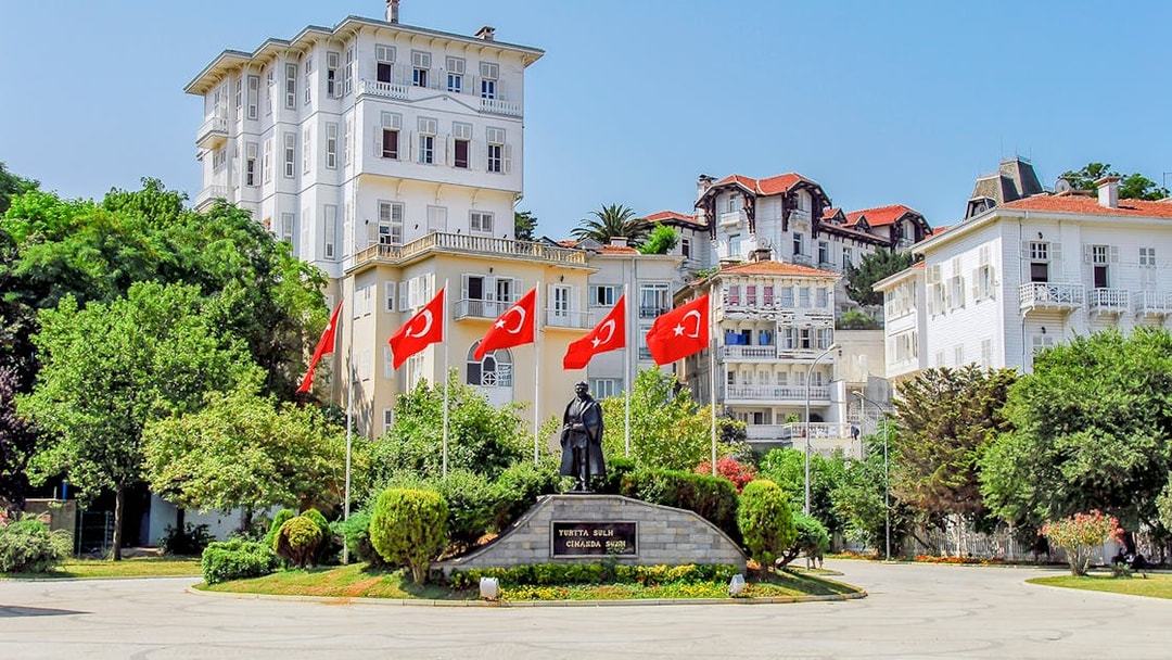 Statue and Turkish flags in a square on Buyukada, Princes Islands, Istanbul.