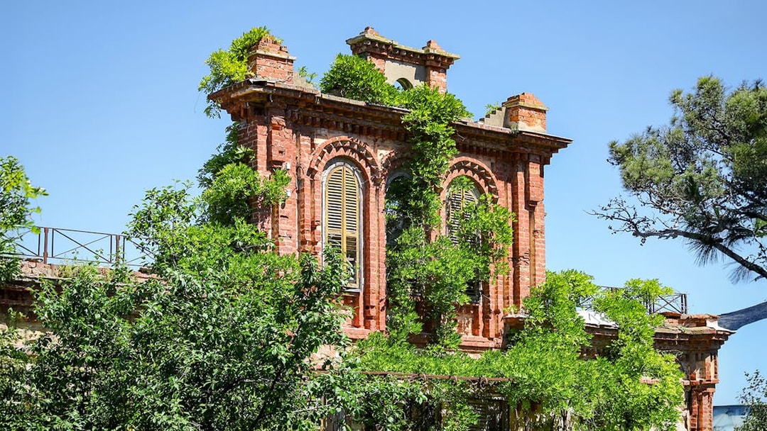 Ruins of Leon Trotsky's house with overgrown greenery on Buyukada Island, Istanbul.