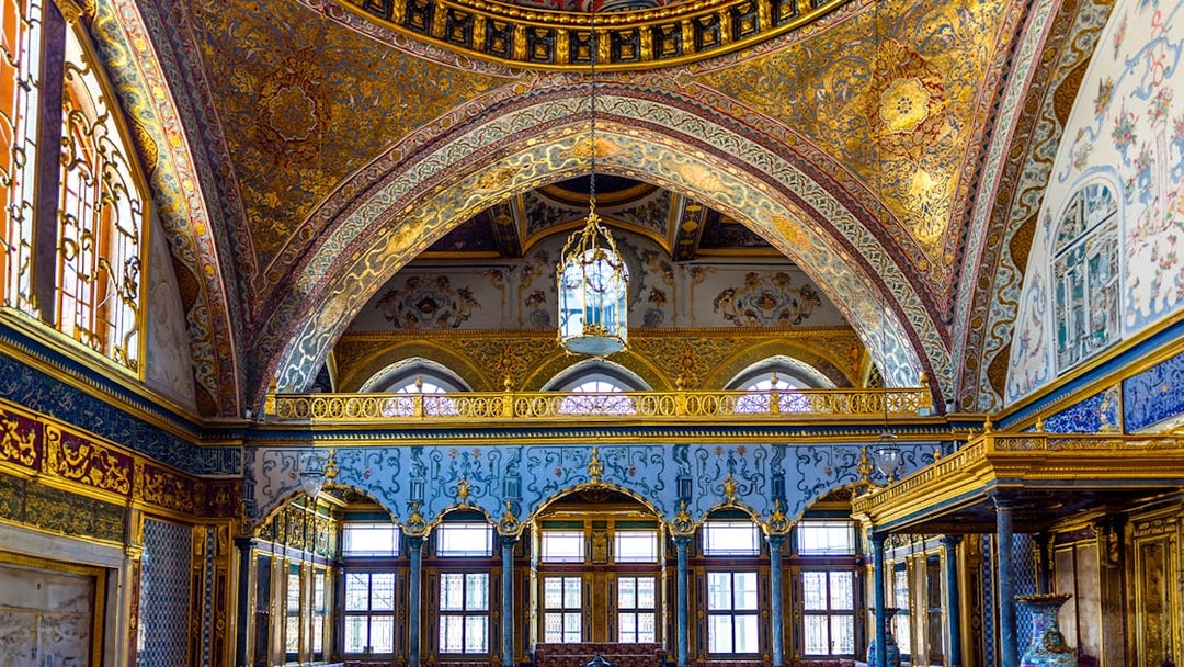 Interior of Topkapi Palace with ornate arches and detailed gold decorations, Istanbul.