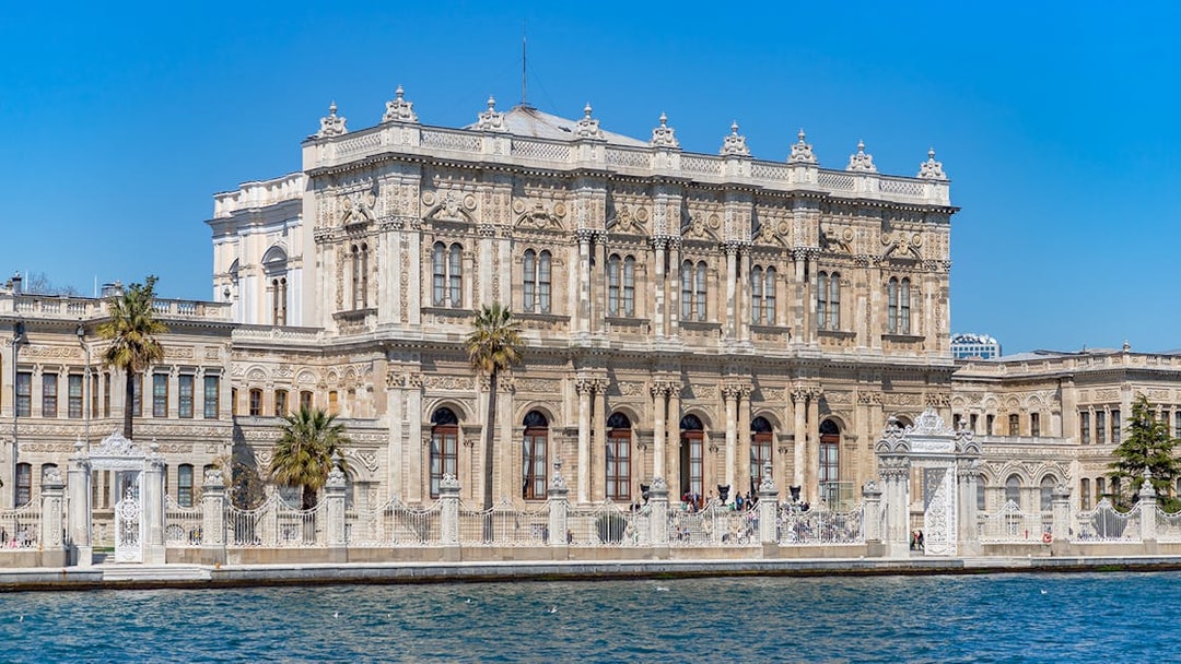 Dolmabahce Palace facade viewed from Bosphorus, Istanbul, Turkey.