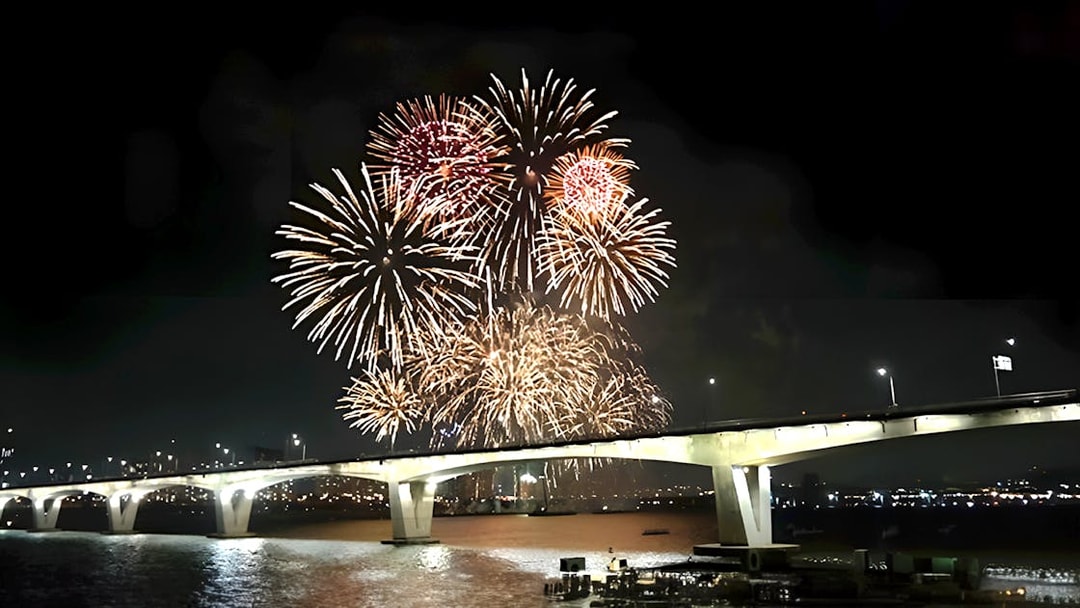 Fireworks display over a bridge during Hangang Cruise in Seoul.