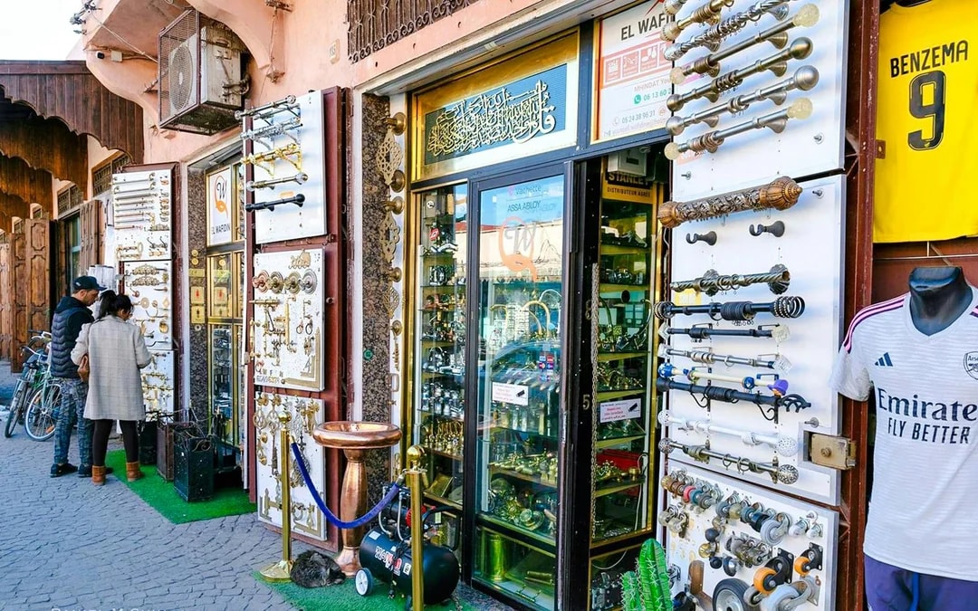 Shopfront displaying metalwork and hardware in Marrakesh souk, Morocco.