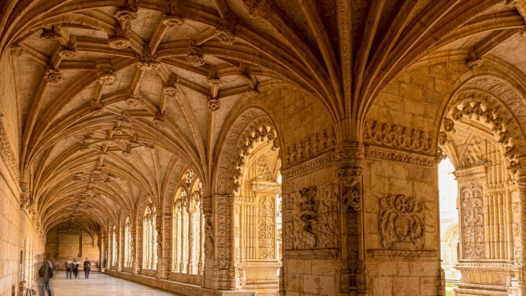 Jeronimos Monastery cloister with intricate vaulted ceiling, Lisbon, Portugal.
