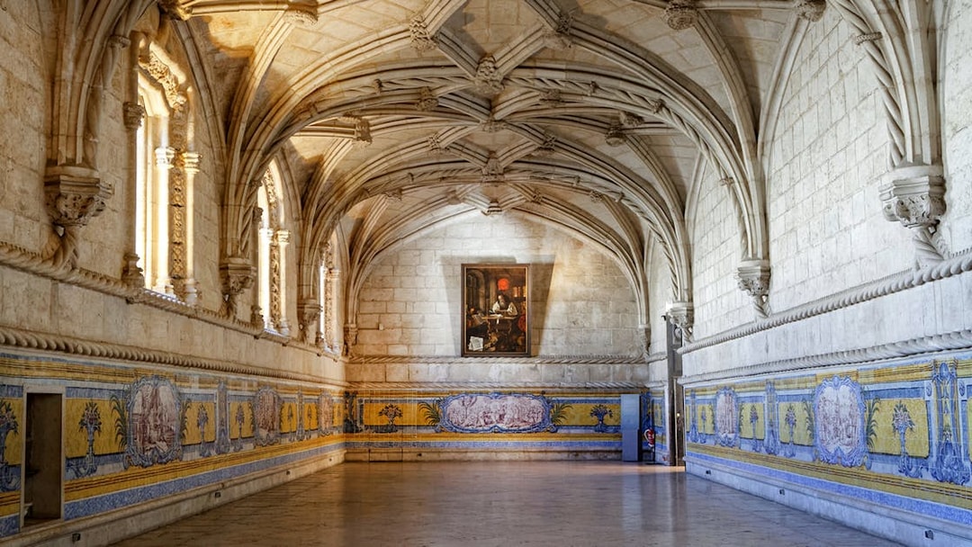 Jerónimos Monastery interior with vaulted ceilings and azulejo tiles, Lisbon, Portugal.