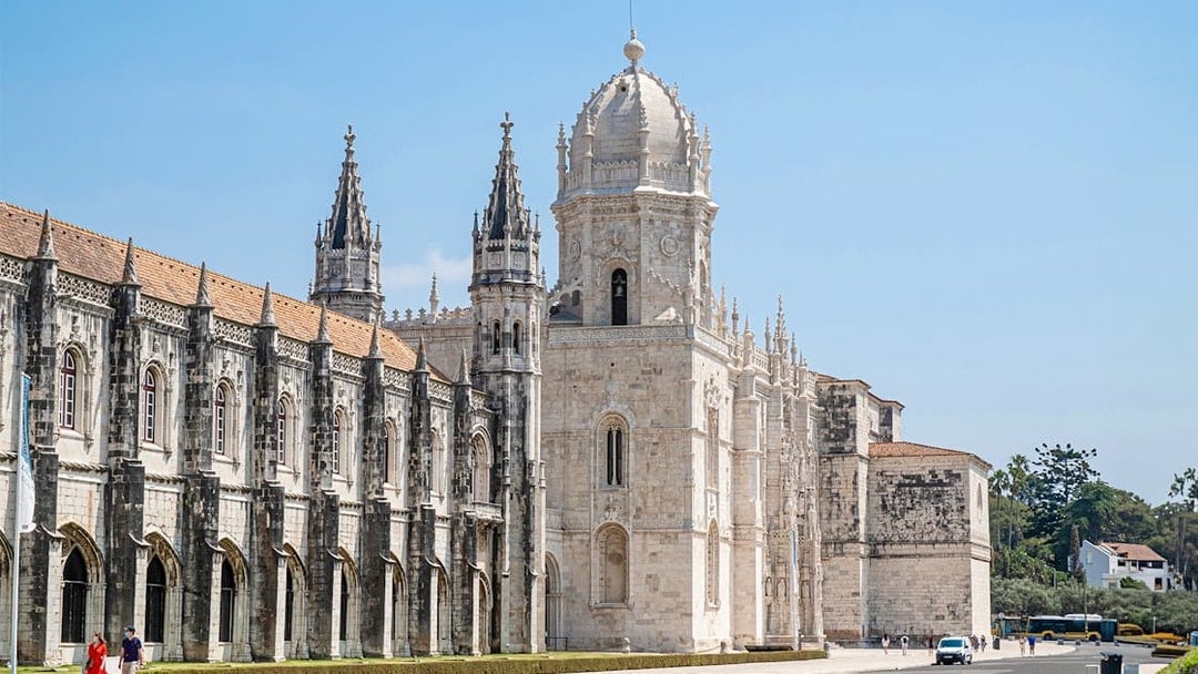Jeronimos Monastery's ornate facade and towers in Lisbon, Portugal.