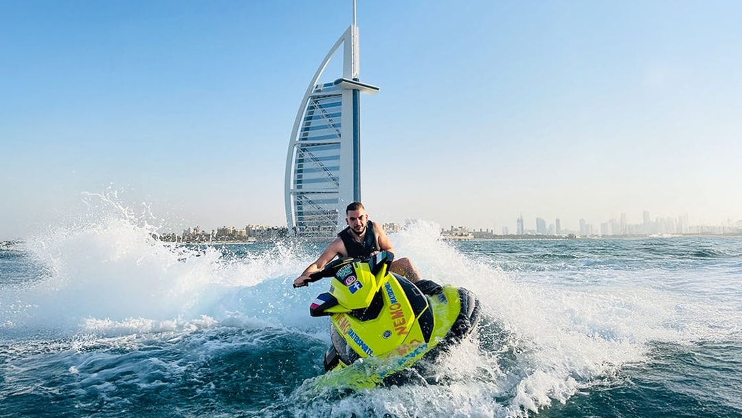 Tourist on jet ski near Burj Al Arab in Dubai.