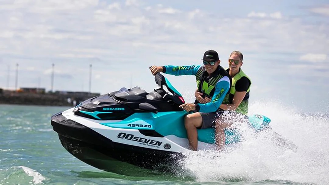 Two people riding a jet ski on a tour in Darwin, Australia.