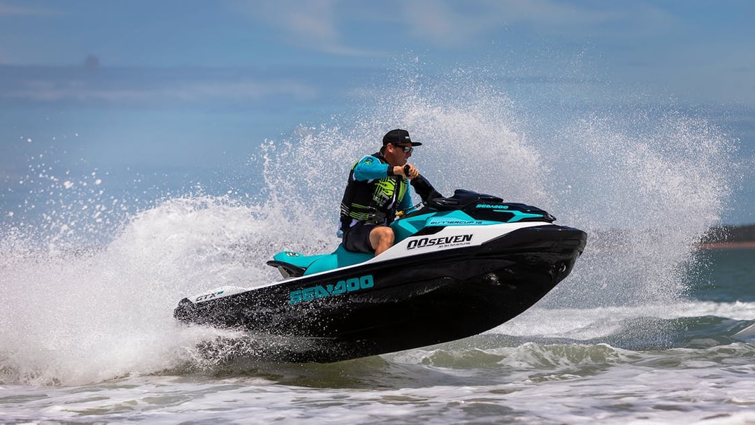 Jet ski rider navigating waves on a tour in Darwin.