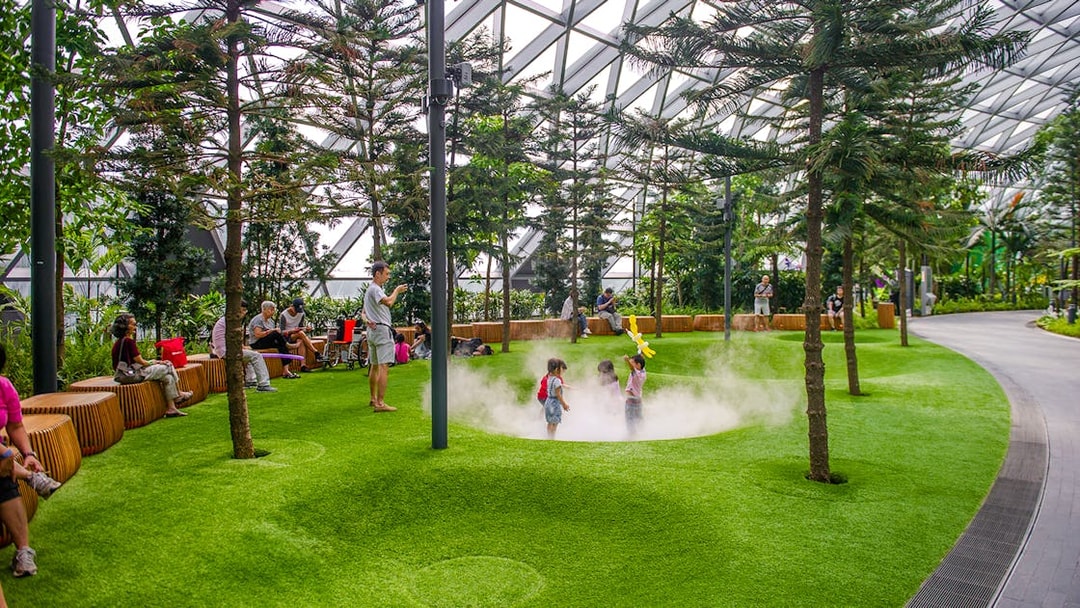 Children playing in Foggy Bowls at Canopy Park, Jewel Changi.