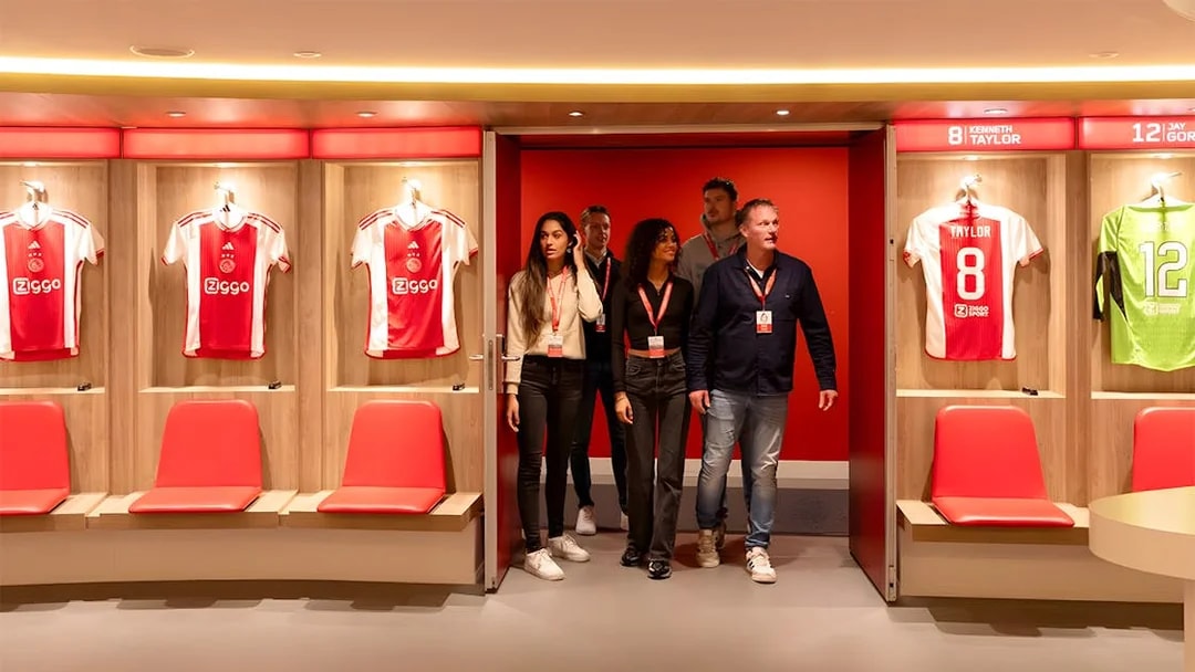 Visitors touring the Johan Cruijff ArenA locker room in Amsterdam.