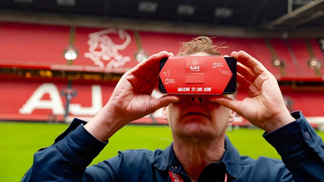 Visitor using VR headset at Johan Cruijff ArenA during Classic Tour in Amsterdam.