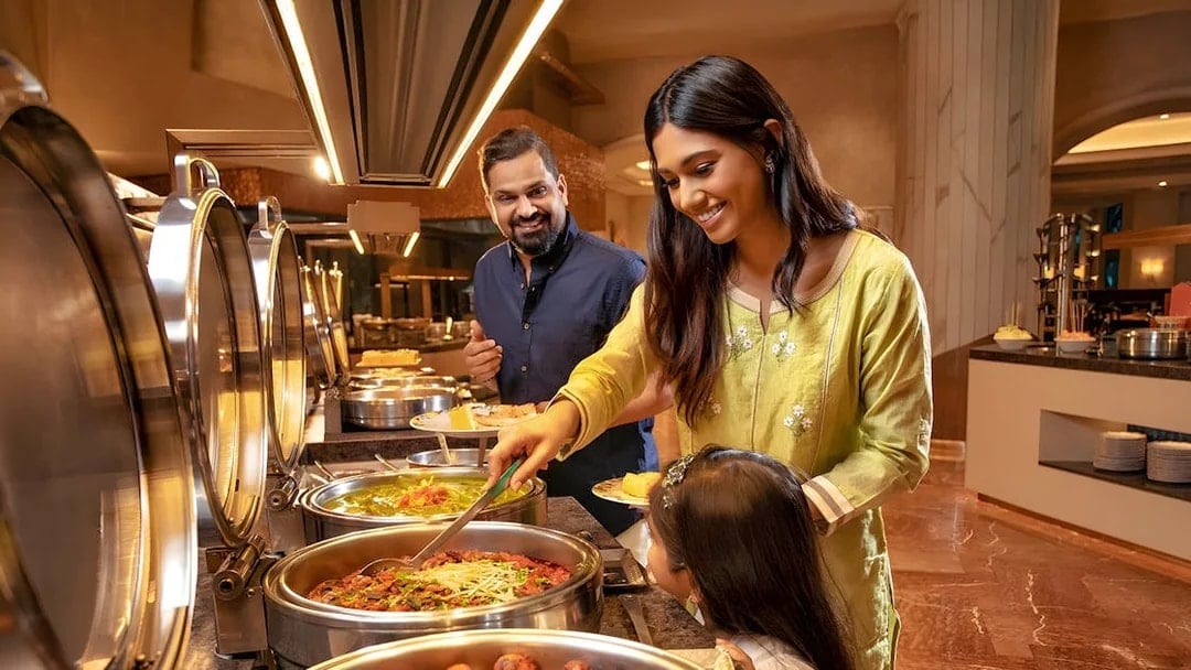 Family enjoying buffet at Kaleidoscope Atlantis Dubai.