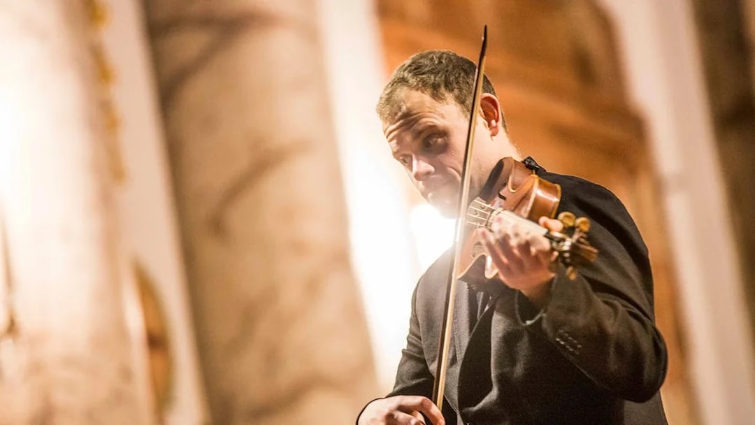 Violinist performing at Vivaldi’s Four Seasons concert in Karlskirche, Vienna.