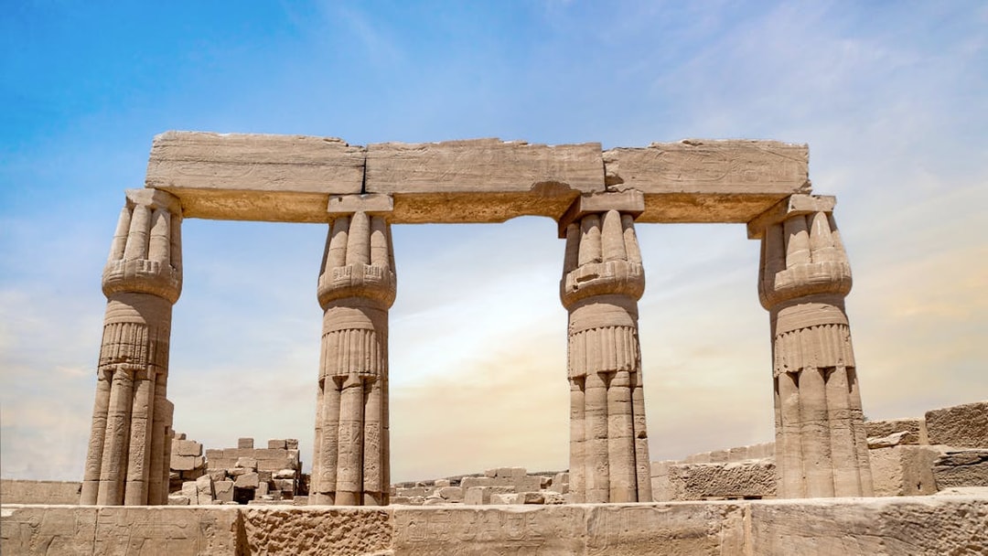 Karnak Temple columns under a clear sky in Luxor, Egypt.