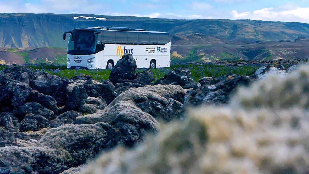 Bus traveling through Icelandic landscape en route to Blue Lagoon.