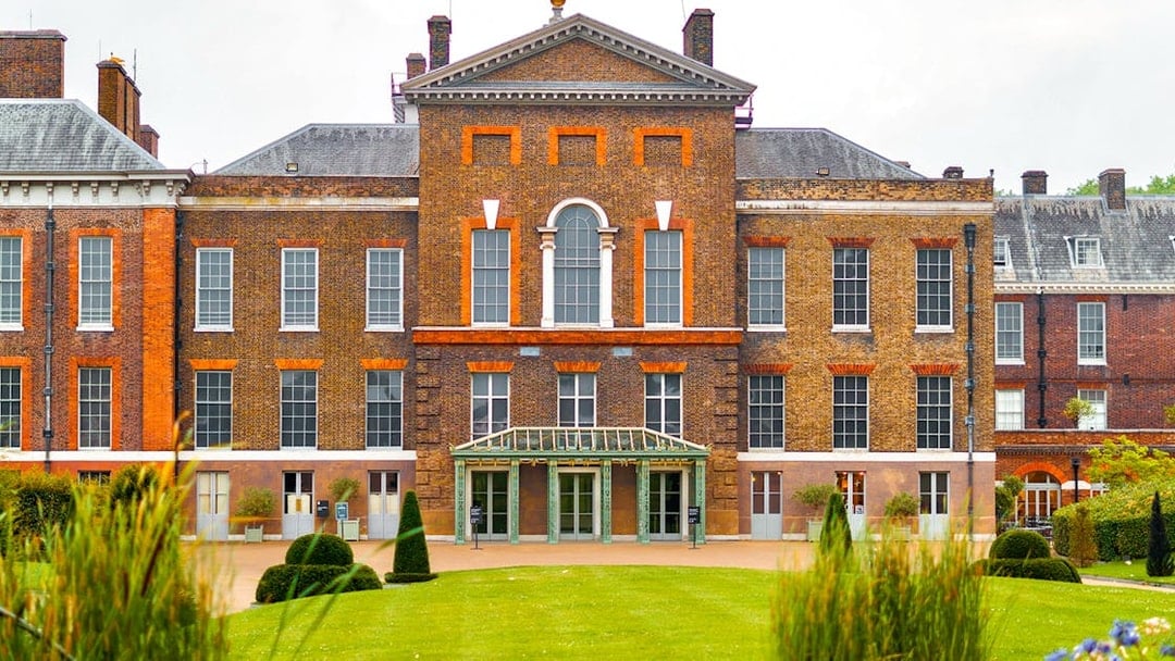 Kensington Palace facade with manicured gardens, London.
