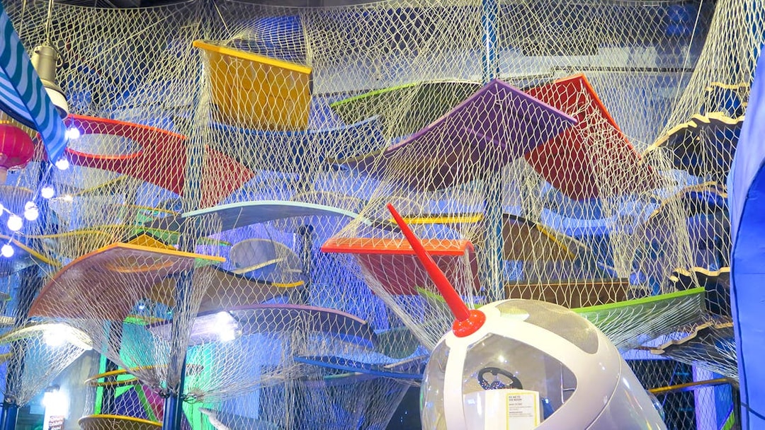 Colorful climbing structure at KidsSTOP Singapore.