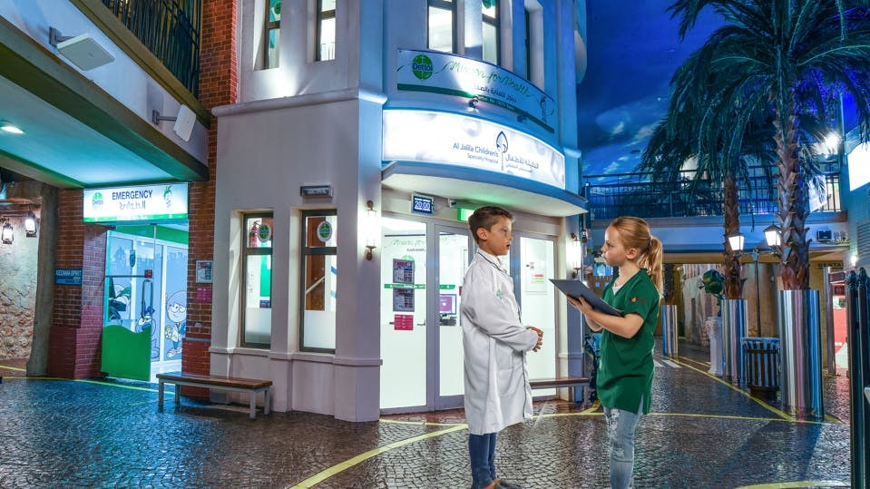 Children role-playing as doctors at Kidzania Dubai.