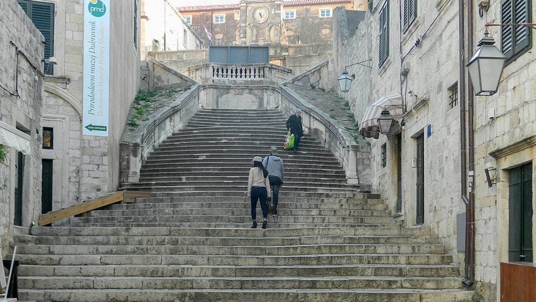 People walking up the Jesuit Staircase in Dubrovnik, featured in King's Landing Walking Tour.