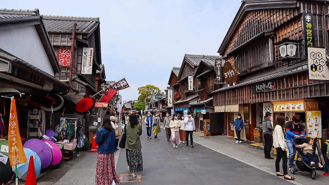Pedestrian street in Ise, Japan with traditional wooden shops, accessible via Kintetsu Rail Pass.