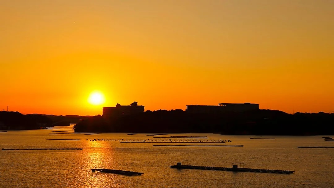 Sunset view over a river in Japan, visible from Kintetsu Rail Pass route.