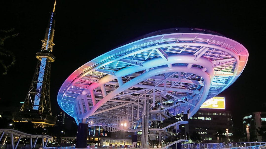 Nagoya TV Tower and Oasis 21 illuminated at night, Japan, accessible with Kintetsu Rail Pass.