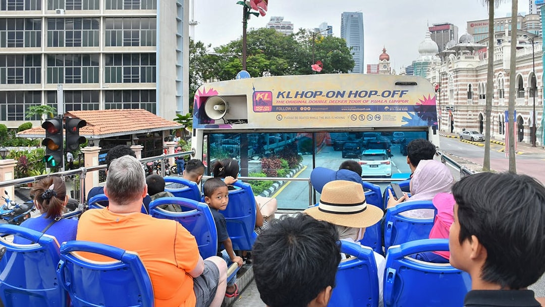 Passengers on a double-decker bus during the Hop-On Hop-Off Tour in Kuala Lumpur.