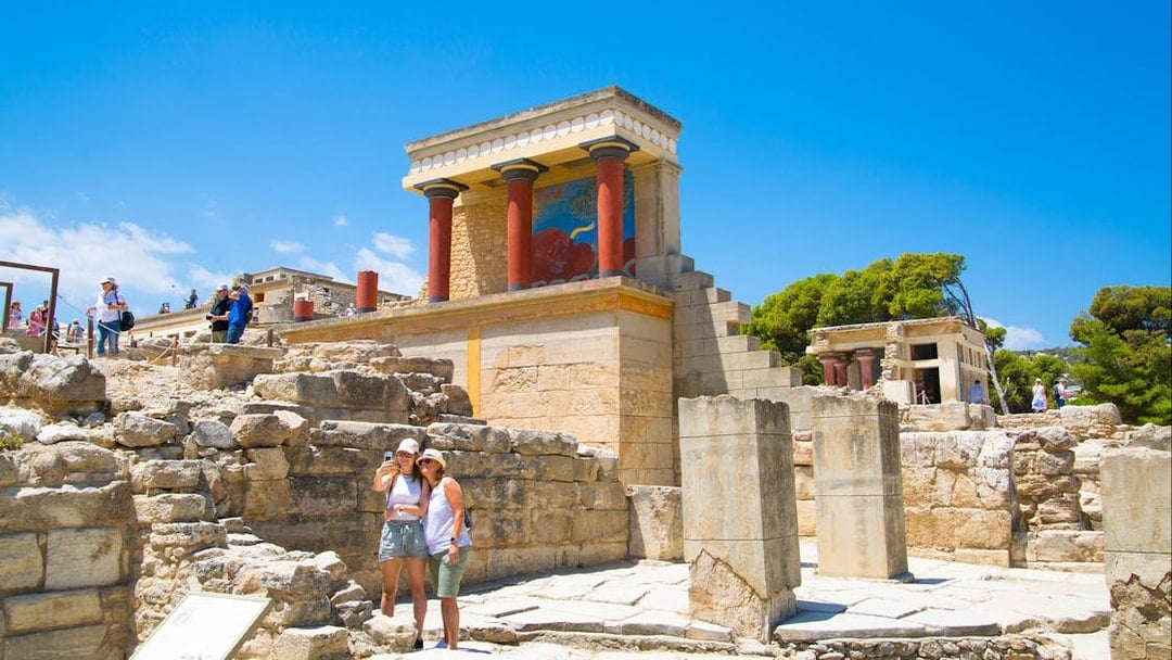 Guests exploring the ancient ruins of Knossos Palace in Crete.