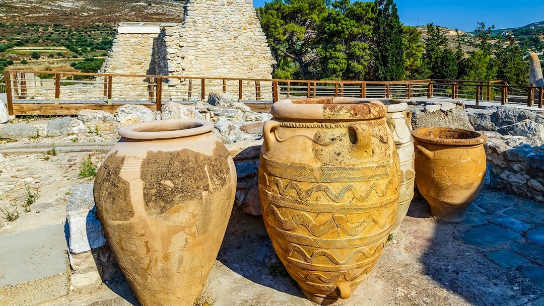 Antique Minoan vases with rope patterns at Knossos palace ruins in Greece.