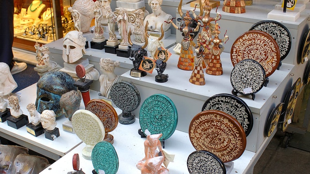 Ancient artifacts and replicas at a market near Knossos Palace, Crete.