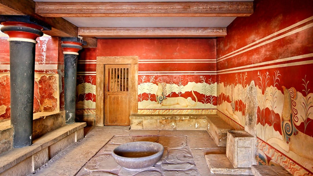 Knossos Palace frescoes and columns, Crete archaeological site.