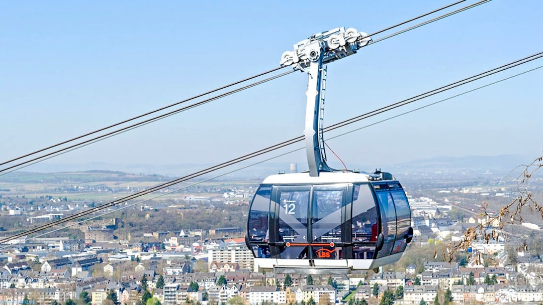 Koblenz Cable Car over cityscape with distant hills in Germany.