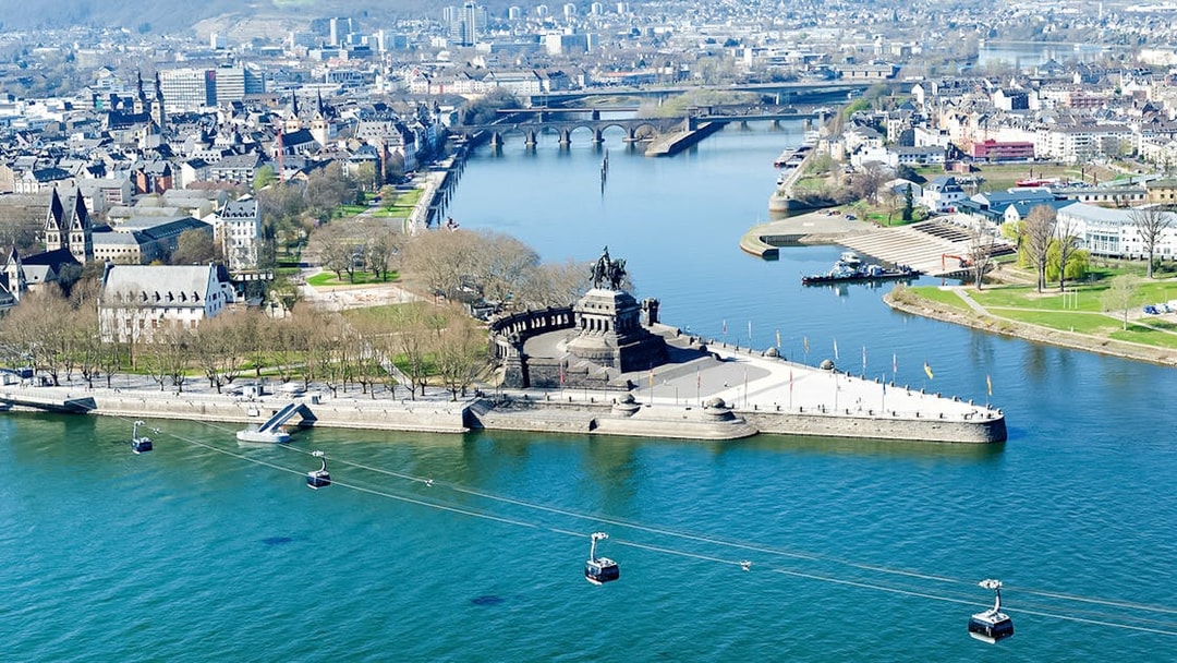 Aerial view of Koblenz from cable car, featuring Deutsches Eck and Rhine River.