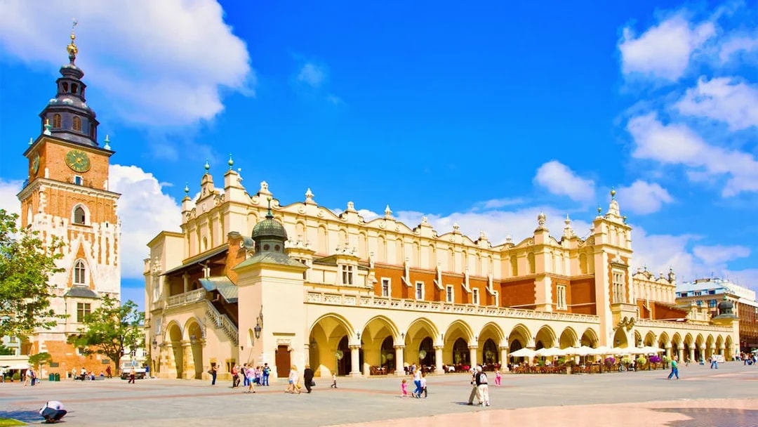Krakow Cloth Hall and Town Hall Tower in Main Market Square during guided city tour.