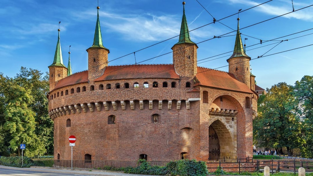 Krakow Barbican with green spires on a guided city tour in an electric car.