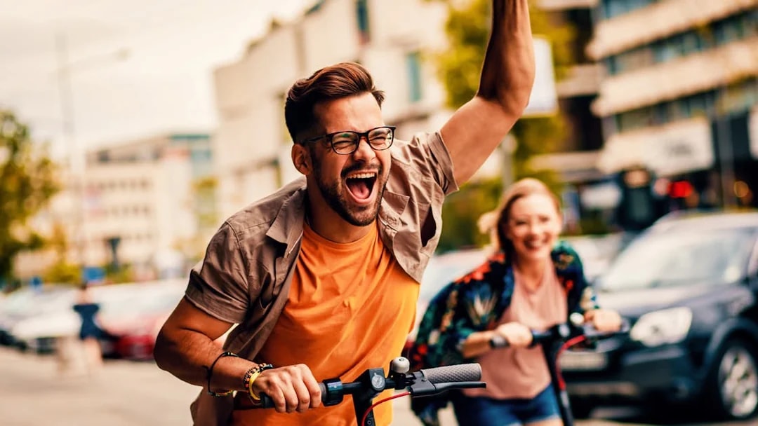 People enjoying a city sightseeing tour on e-scooters.