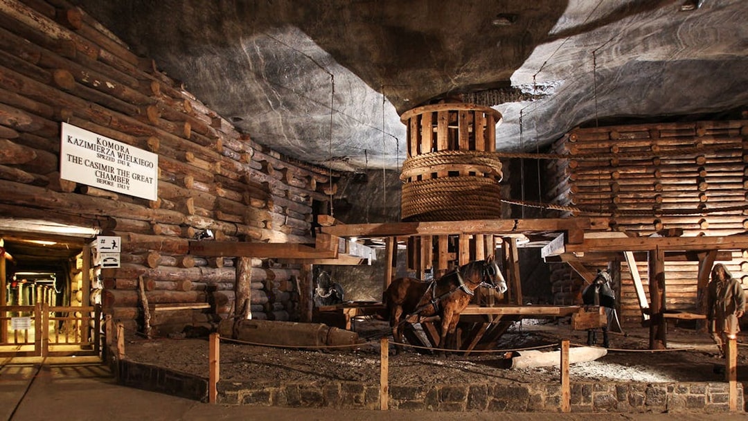 Wieliczka Salt Mine's Casimir the Great Chamber with wooden structures and horse figures.