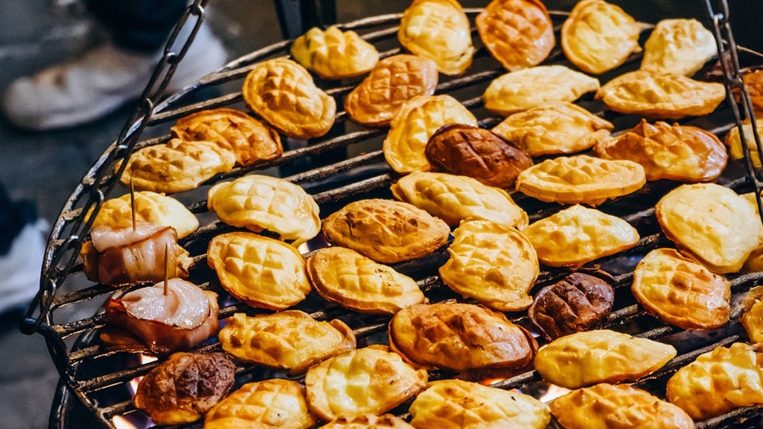 Grilled oscypek cheese on a barbecue during a Zakopane full-day trip.