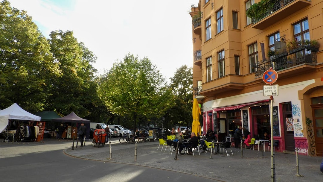 Street cafe and market stalls in Kreuzberg, Berlin during a guided food tour.