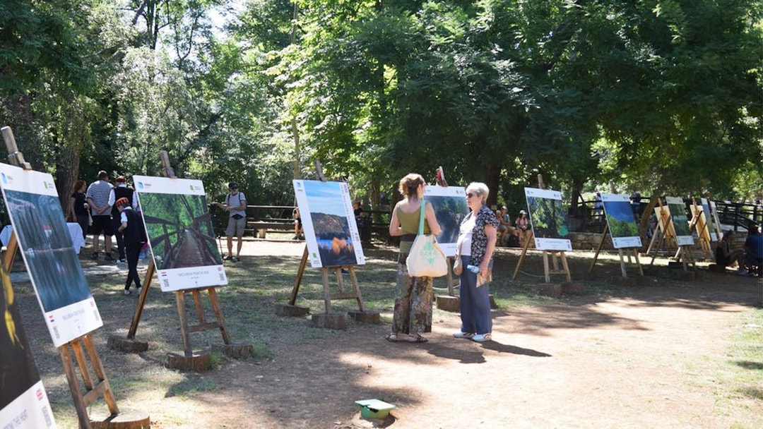 Visitors viewing outdoor exhibits at Krka National Park.