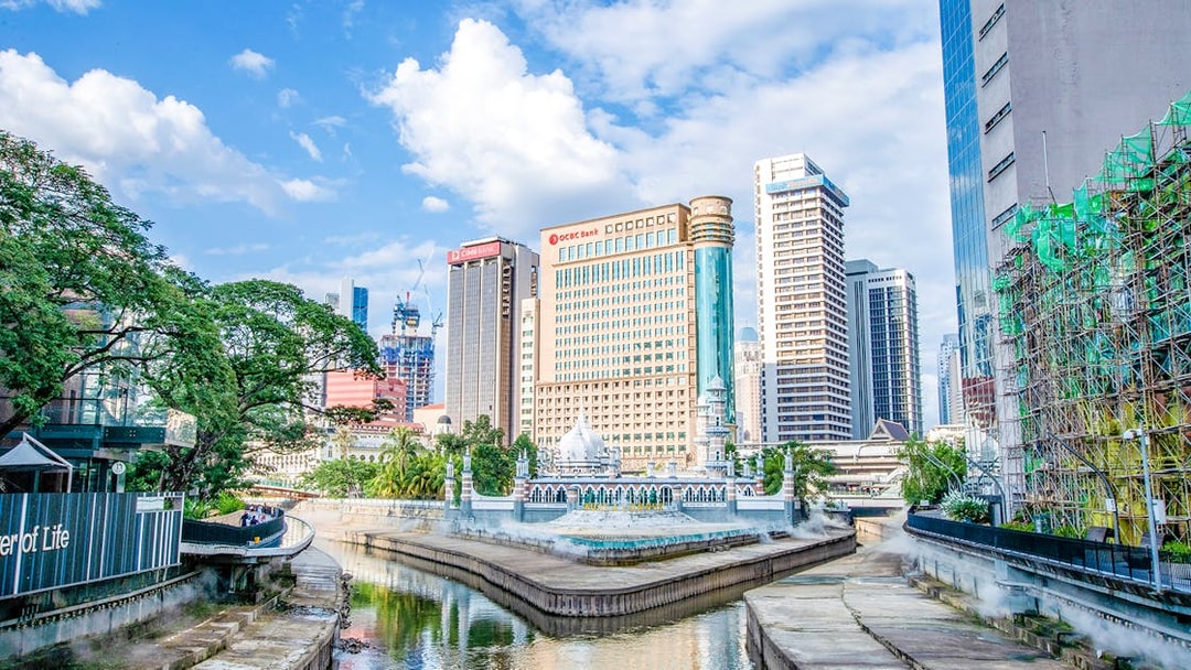 Kuala Lumpur skyline with Jamek Mosque by the river.