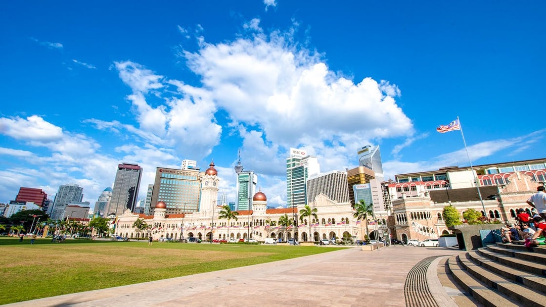 Sultan Abdul Samad Building with Kuala Lumpur skyline on guided tour.
