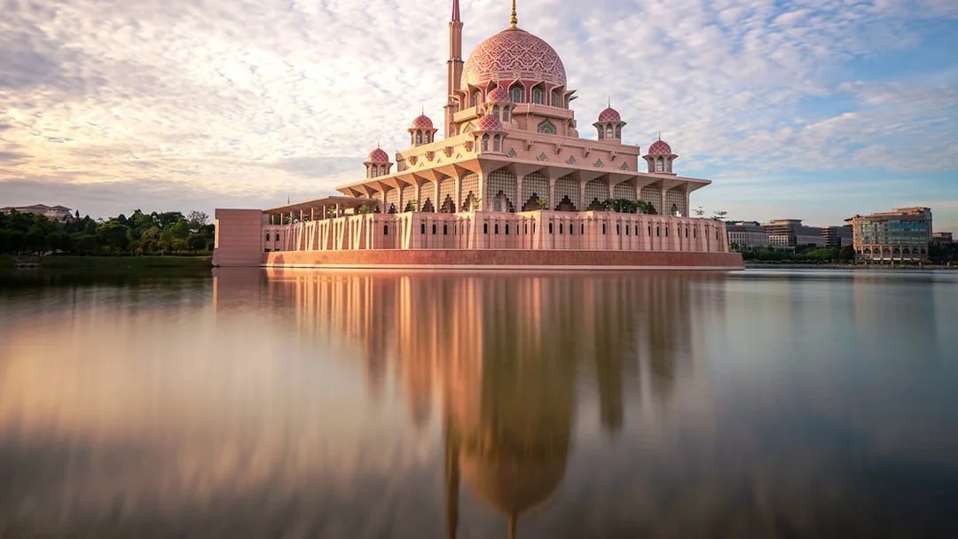 Putra Mosque reflecting in the lake at sunset, Kuala Lumpur.