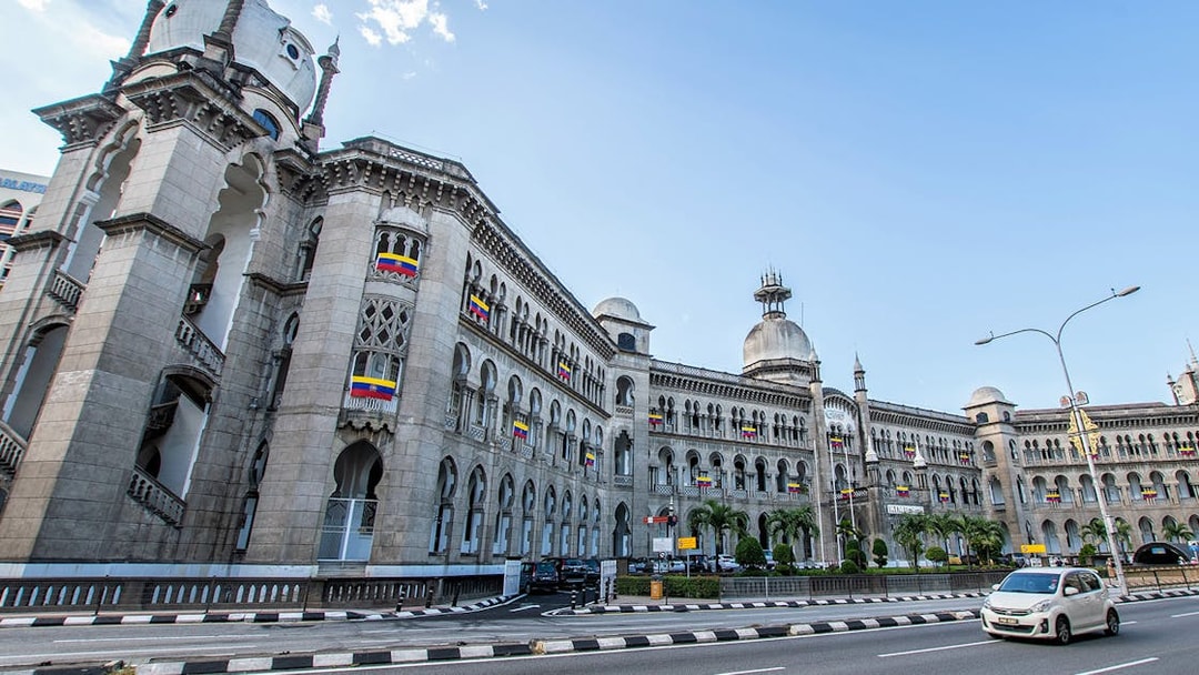Kuala Lumpur Railway Station with colonial architecture on a sunny day.