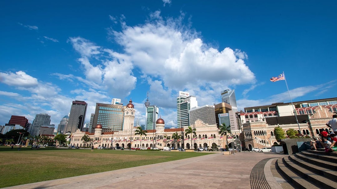 Sultan Abdul Samad Building with Kuala Lumpur skyline in the background.